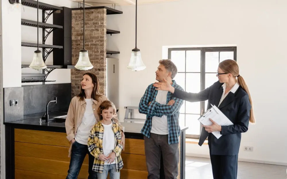 family with lady realtor